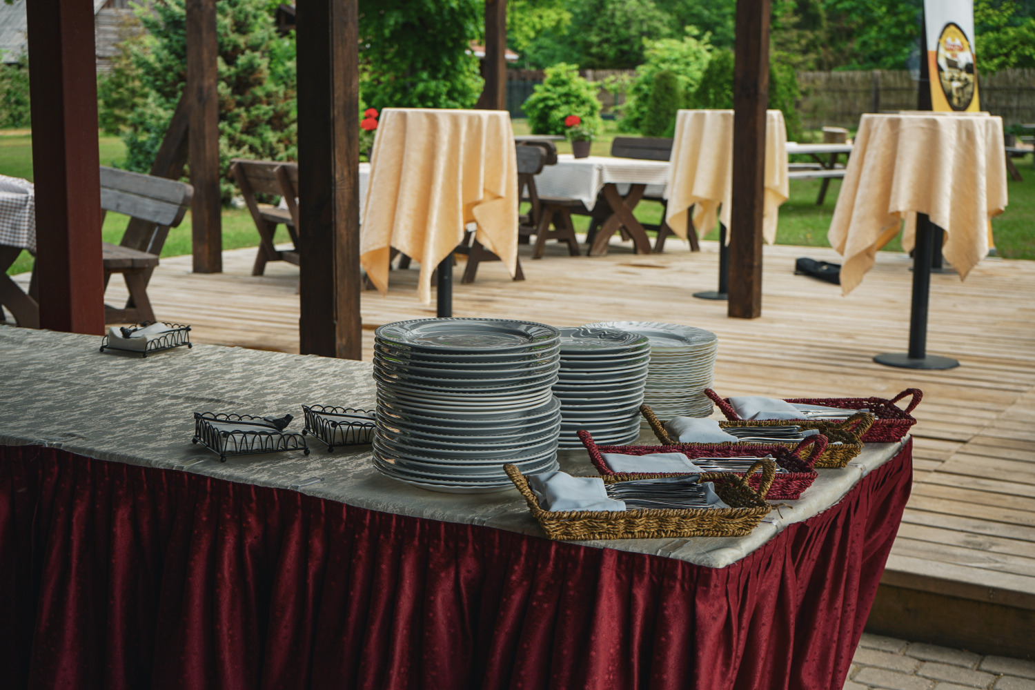 Buffet table dressed in maroon linen for a private event